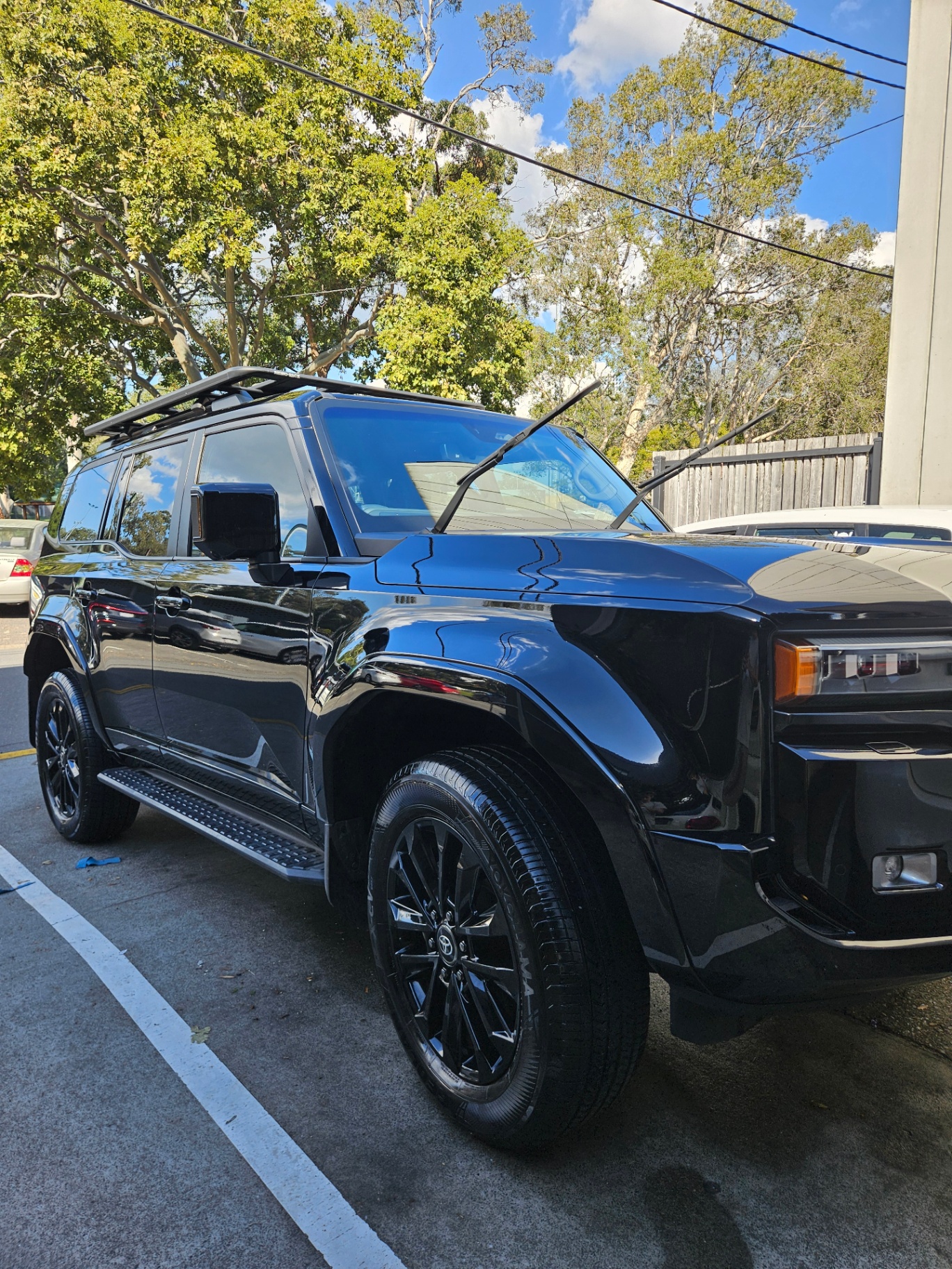 Glossy black Toyota Land Cruiser detailed to a mirror finish