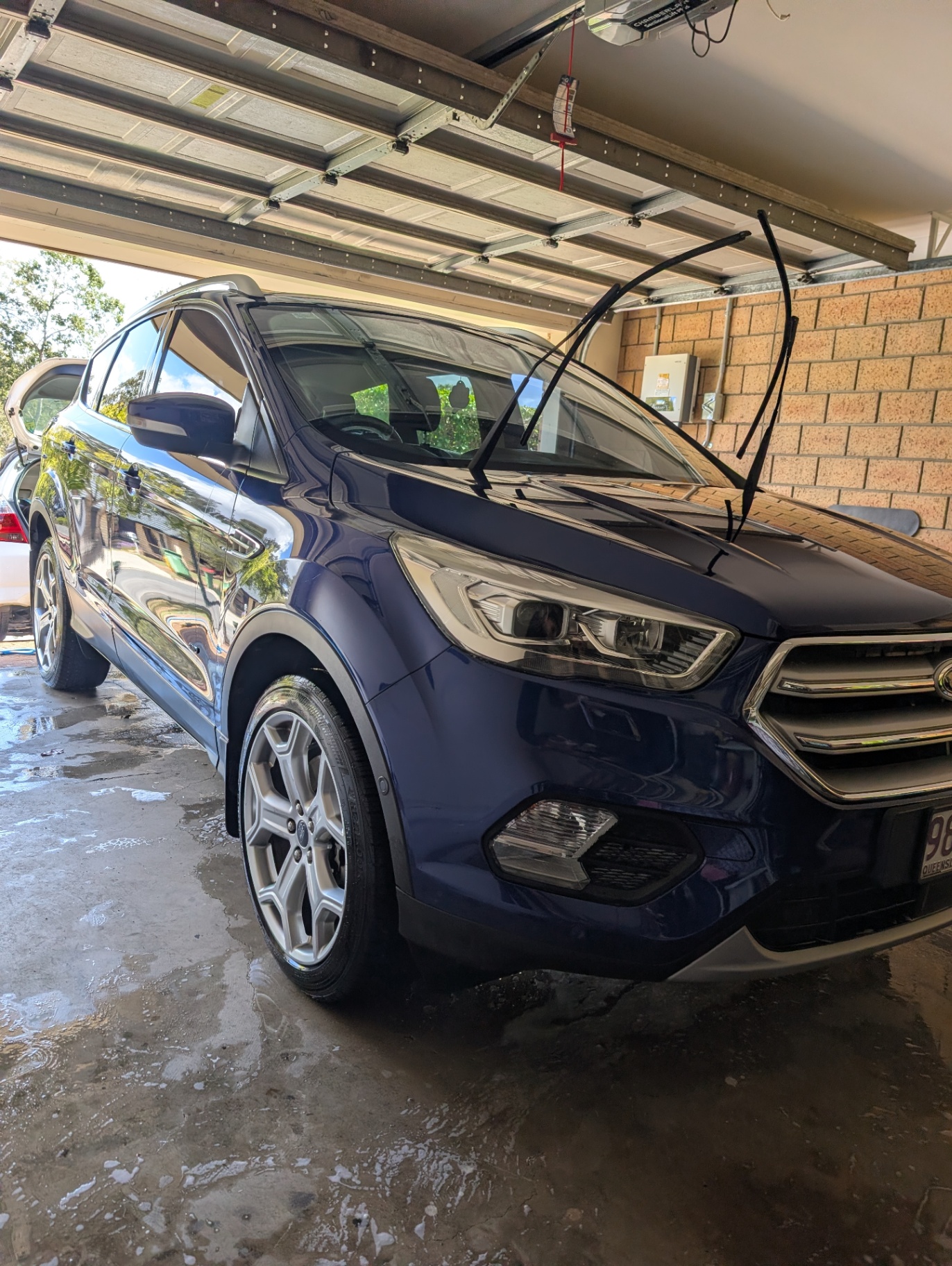 Deep blue Ford Escape detailed by CrownX Auto Spa